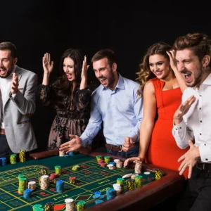 group-young-people-roulette-table-black-background-young-people-made-bets-game-wait-result-bright-emotions